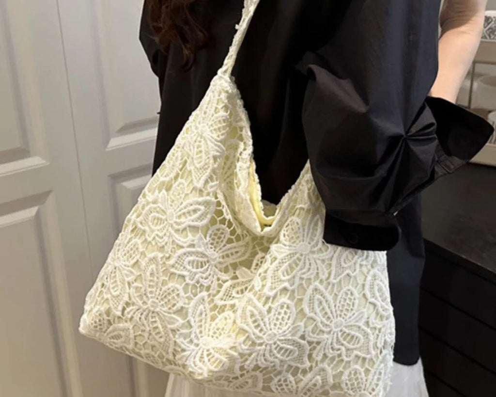 Lace pattern shoulder bag with floral crochet design, cream-colored crossbody bag with strap