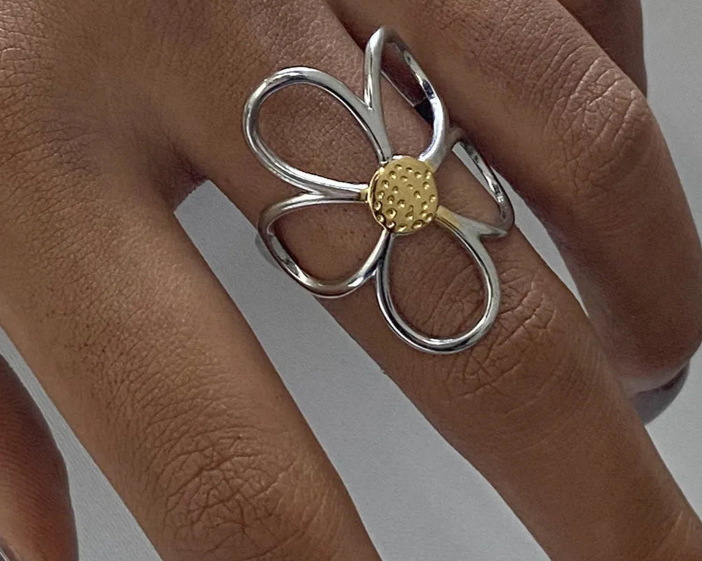 Two-tone daisy flower ring with gold and silver petals, adjustable open ring on hand - floral fashion jewelry